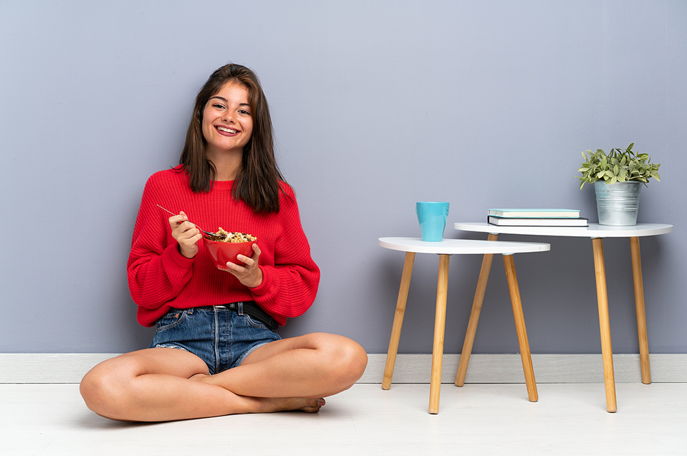 A Girl is Sitting on the Floor